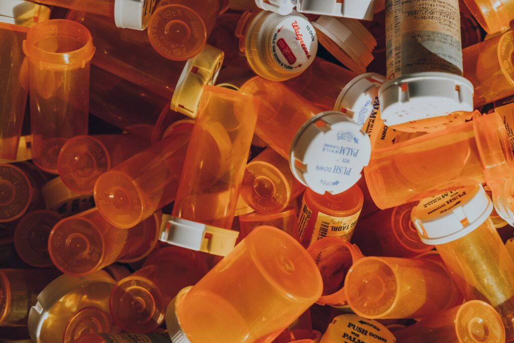 an image of prescription bottles representing mixing alcohol and prescription drugs