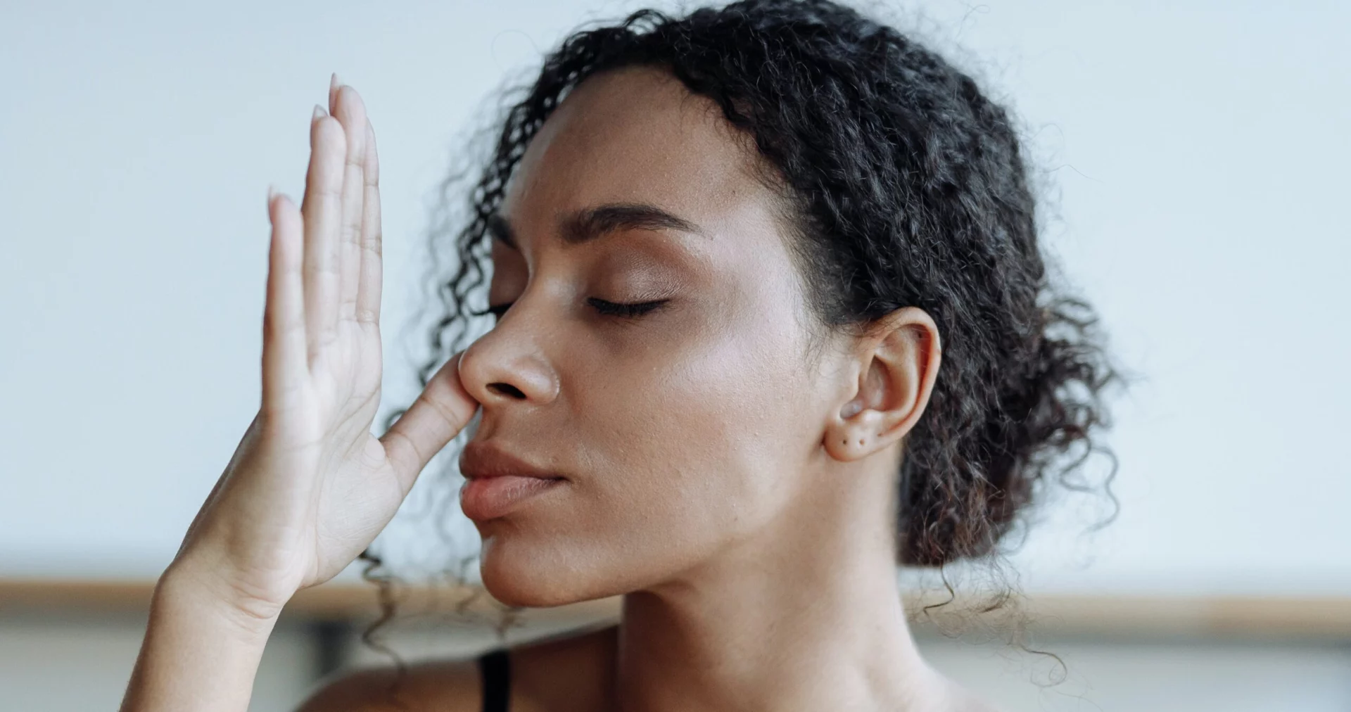A woman does breathwork representing breathwork for addiction.