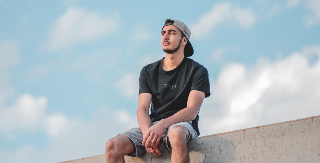 A man sits on a bench representing ativan addiction symptoms