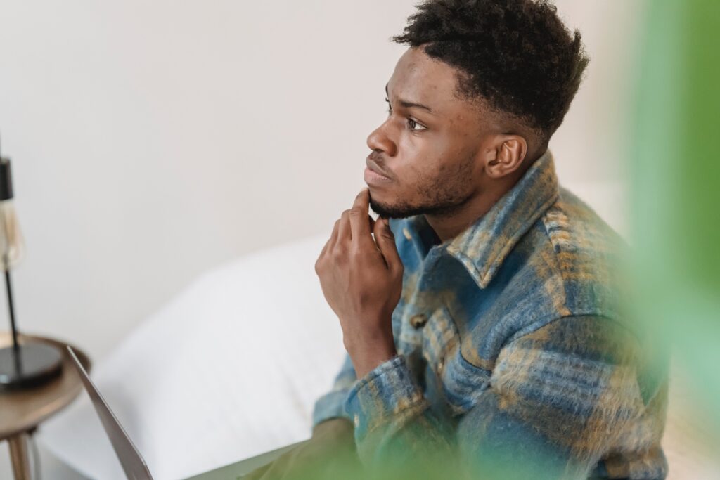 A man holding his hand to his chin, asking if you can overdoes on Lexapro