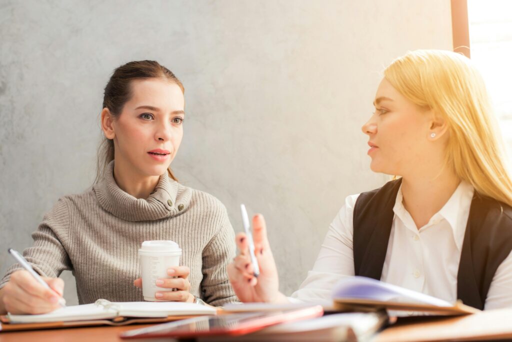 Two women in an office setting discussing the topic: What are benzodiazepines used for?